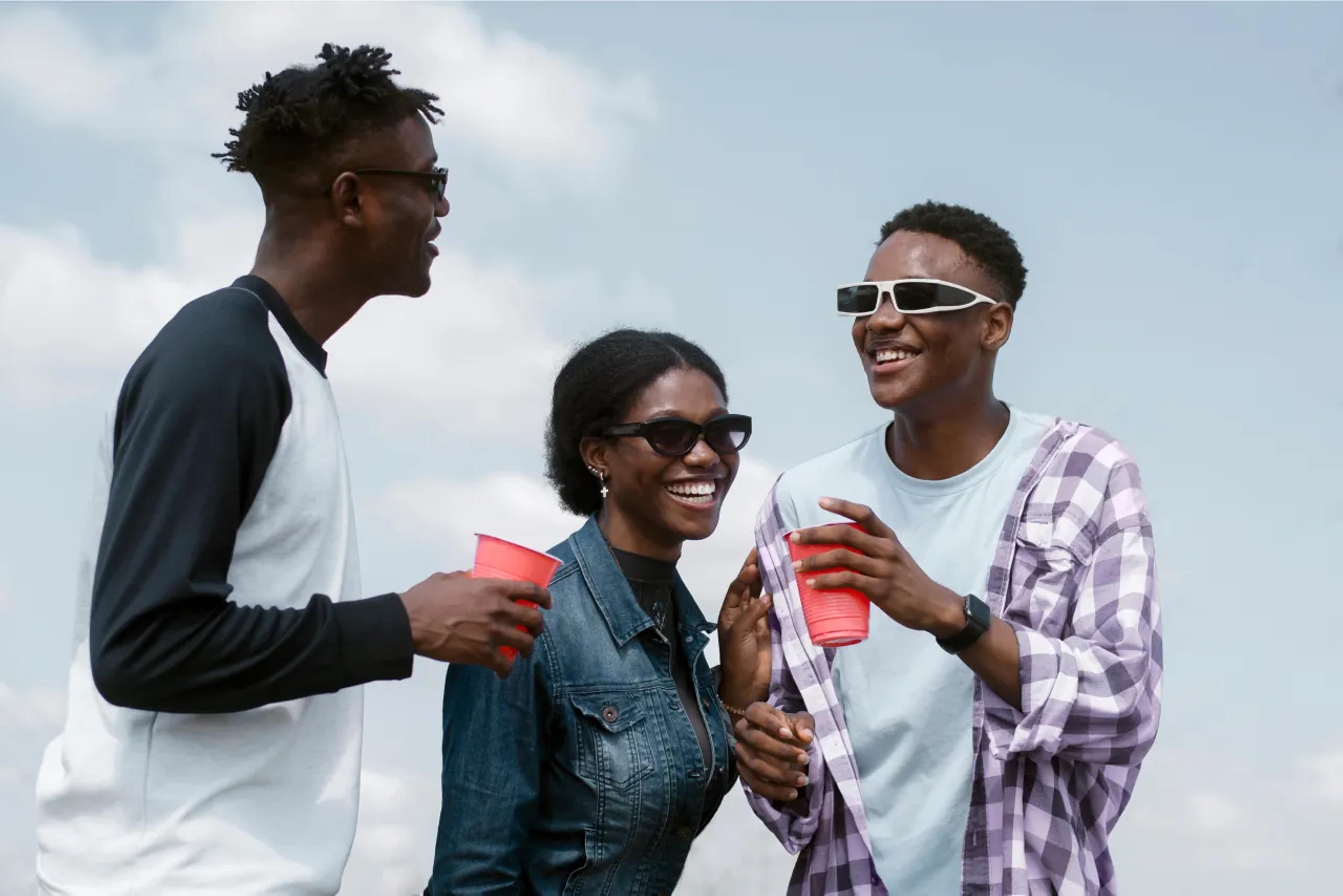 Youths having drinks outdoors